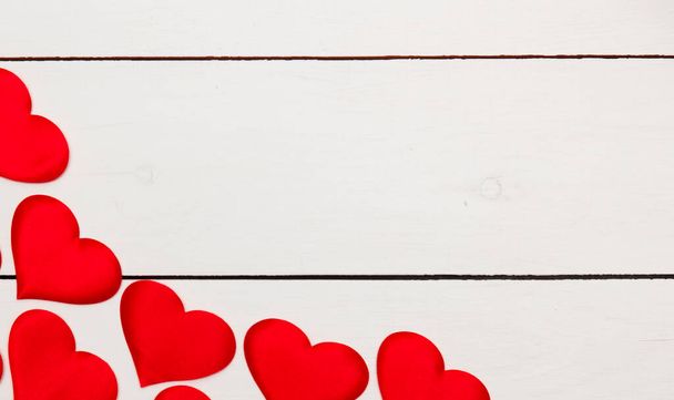 Flatlay composition with hearts on a wooden background. - Valokuva, kuva
