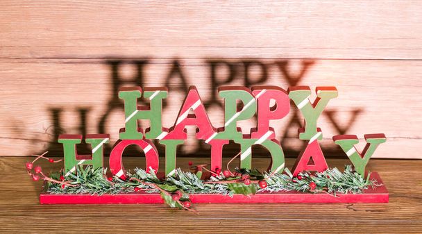 happy holiday board on wooden background - Foto, Bild
