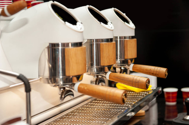 Professional industrial coffee machine in a bar . - Фото, изображение