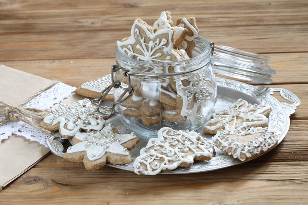 Christmas cookies in glass jar on wooden background - Foto, immagini