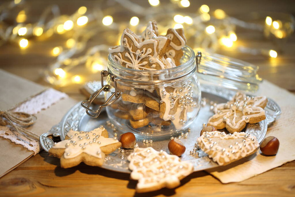 Gingerbread Cookie with Christmas Garland Lights - Fotografie, Obrázek