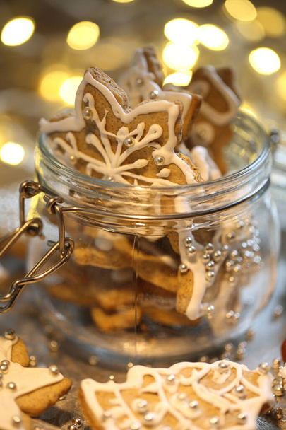 Gingerbread Cookie with Christmas Garland Lights - 写真・画像