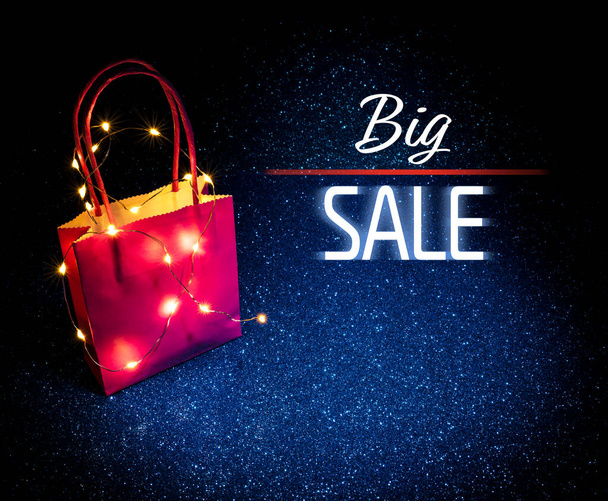 Shopping bag on glitter background texture sparkling with word Big Sale. For gifts, deals, sales, event or Christmas holiday seasonal decoration. Online sales concept. - Photo, Image