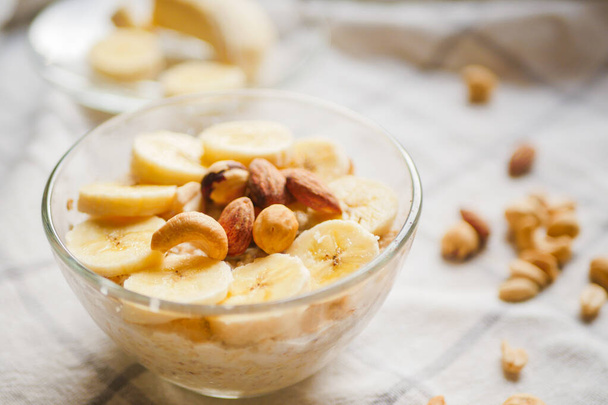 Overnight oats with banana slices and nuts. Home cooked breakfast. Vegetarian meal. Healthy recipes - Photo, Image