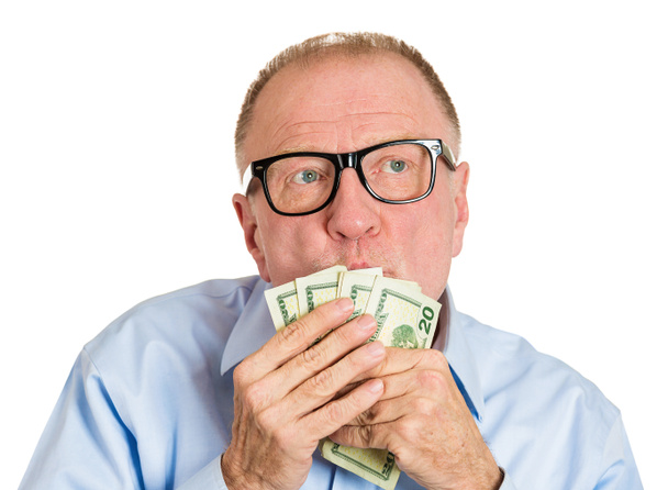 volwassen man zoenen dollar bankbiljetten - Foto, afbeelding