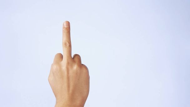 man hand showing gesture Middle Finger meaning in western cultures Fuck you or fuck off isolated white background. - Photo, Image