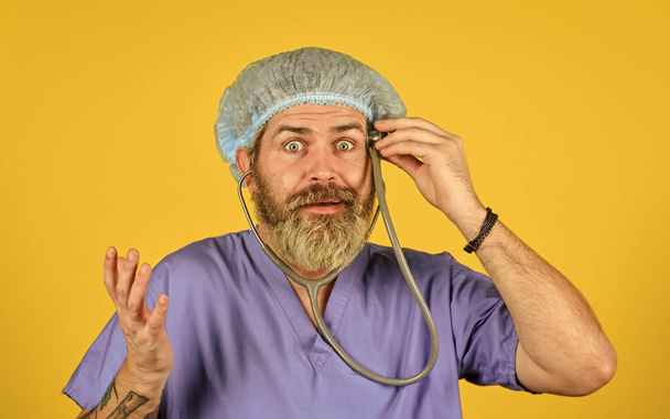 Medical insurance. Virus concept. Man work hospital. Bearded doctor uniform stethoscope. Medical check up. Medical help. Take care of yourself. Burnout and nervous system disease. Monitor symptoms - 写真・画像