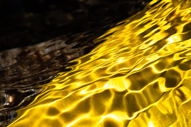 Nature Abstract : Flow of Submerged Golden Color Rippling Across the Frame - Photo, image
