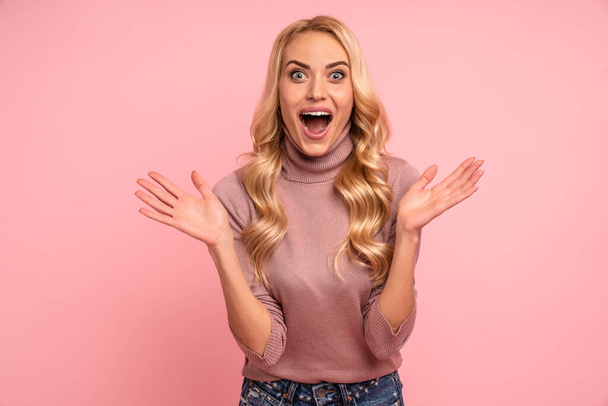 Image of excited screaming young woman standing isolated over pink background. Looking camera - Photo, Image