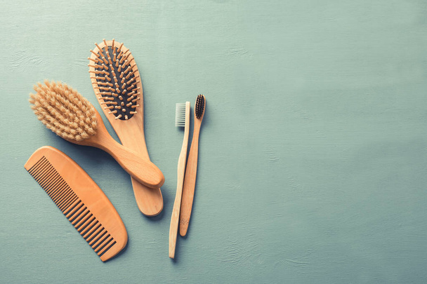 Body care with eco-friendly accessories. Bamboo toothbrushes and combs. - Photo, Image