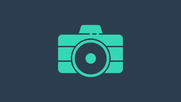 Icono de la cámara fotográfica turquesa aislado sobre fondo azul. Icono de cámara fotográfica. Animación gráfica de vídeo 4K - Metraje, vídeo
