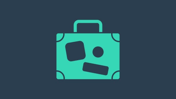 Tyrkysový kufr pro cestovní ikonu izolované na modrém pozadí. Cestovní nápis zavazadel. Ikona cestovních zavazadel. Grafická animace pohybu videa 4K - Záběry, video