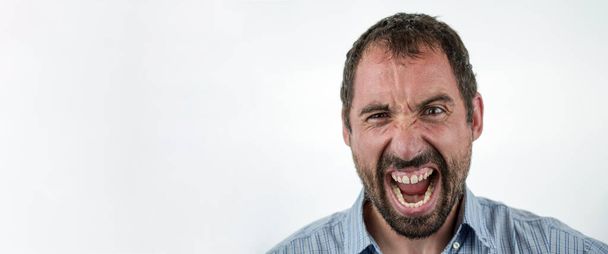Portrait of angry insane man screaming isolated on white background - Fotó, kép