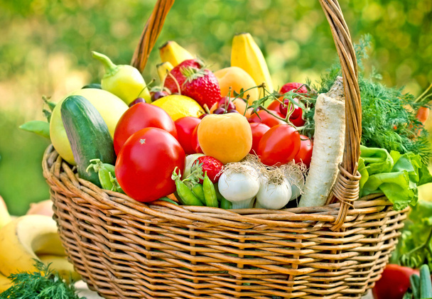 Wicker basket full of fruits and vegetables - Photo, Image