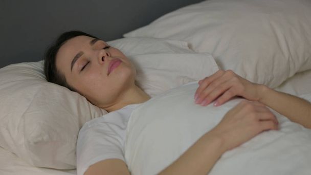 Peaceful Young Woman Sleeping in Bed  - Foto, Bild