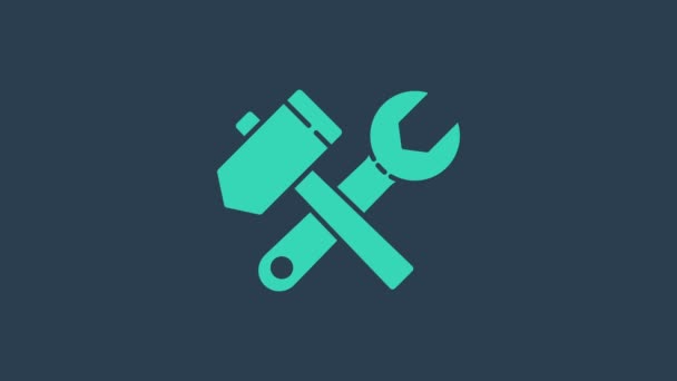Turquoise Crossed hammer and wrench spanner icon isolated on blue background. Hardware tools. 4K Video motion graphic animation - Footage, Video