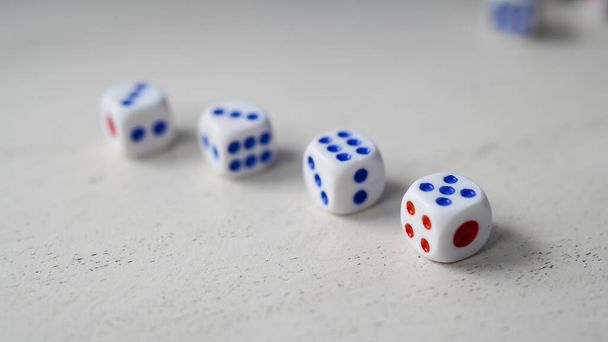 Randomly arranged white dice with blurry dice background - Photo, Image