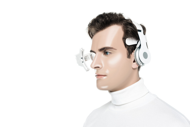 Portrait of cyborg man in digital eye lens and headphones isolated on white - Photo, Image