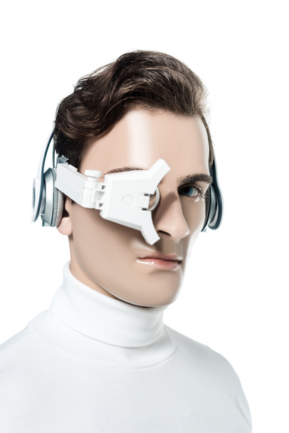 Cyborg man in digital eye lens and headphones looking at camera isolated on white - Foto, afbeelding