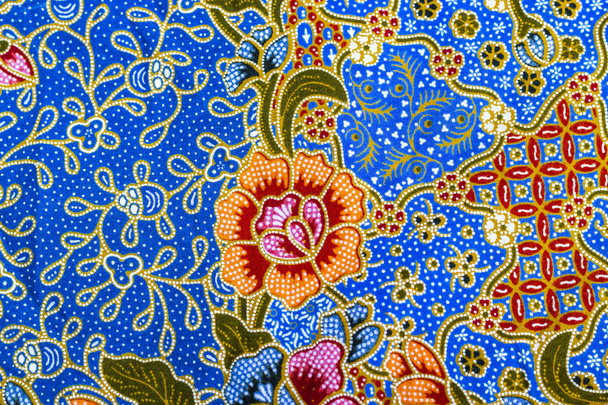 Oranje bloemenpatroon op batik - Foto, afbeelding