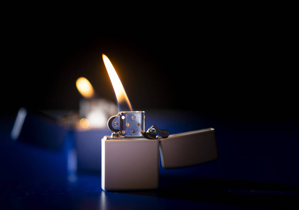 lighter closeup with flame - 写真・画像