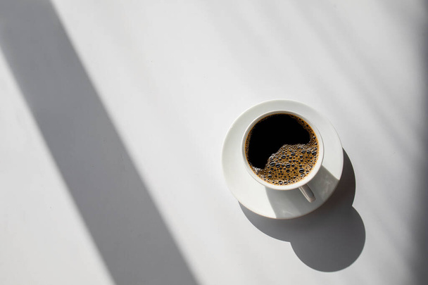 hot coffee on white table background. space for text. top view - 写真・画像