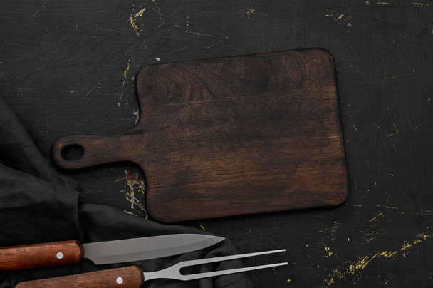 Wooden cutting board on wooden table - Foto, Imagem