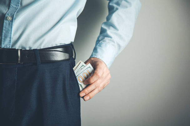 man hand money on pocket - Фото, изображение