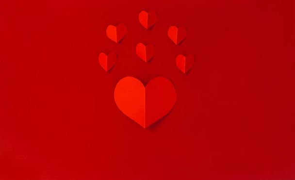 Valentine's Day concept with red hearts on red background,  Flat lay, copy space - Фото, зображення