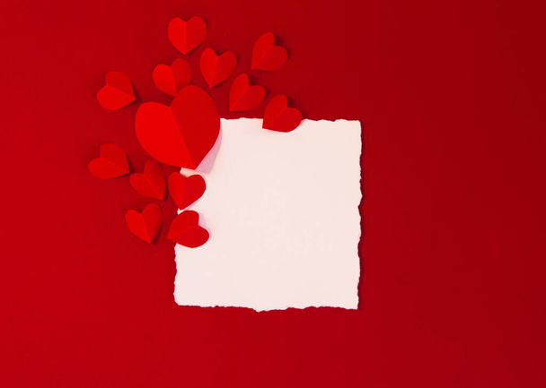Card for text on red background and hearts red, concept Valentine's day wedding greeting, copy space - 写真・画像