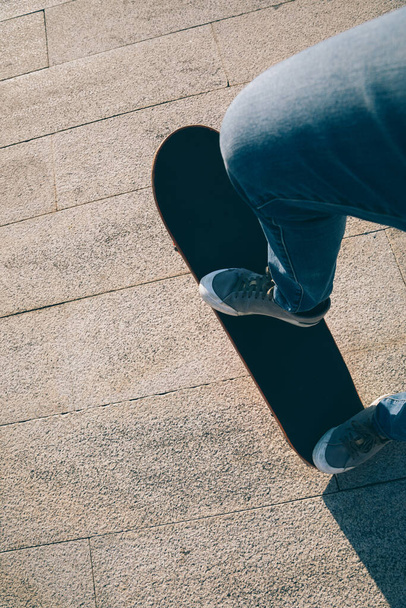 Skateboarder skateboarding outdoors on sunny morning - Fotoğraf, Görsel