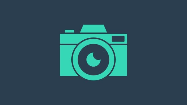 Tyrkysová ikona fotoaparátu izolované na modrém pozadí. Ikona fotoaparátu. Grafická animace pohybu videa 4K - Záběry, video
