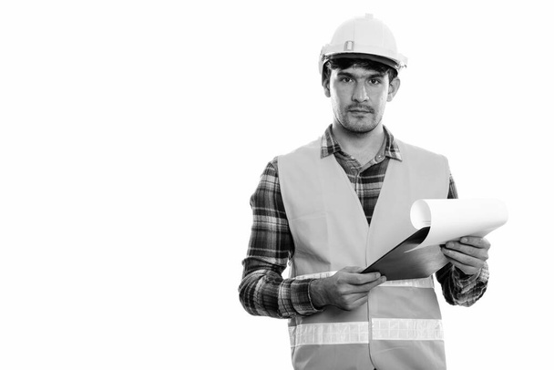 Young Persian man construction worker holding clipboard - Photo, Image