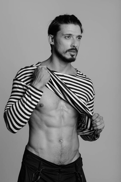 Portrait of handsome man shot in black and white - Fotografie, Obrázek