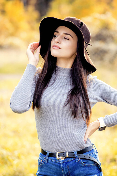 Portrait of beautiful woman in autumn park - Fotografie, Obrázek
