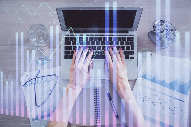 Double exposure of woman hands working on computer and forex graph hologram drawing. Top View. Financial analysis concept. - Photo, image