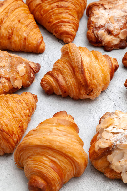 Fresh baked croissants on cement background - Photo, Image