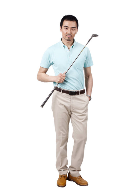 Young man wearing a suit and golfing - Photo, Image
