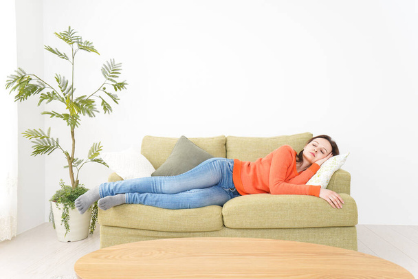 Woman taking a nap at home - Fotó, kép