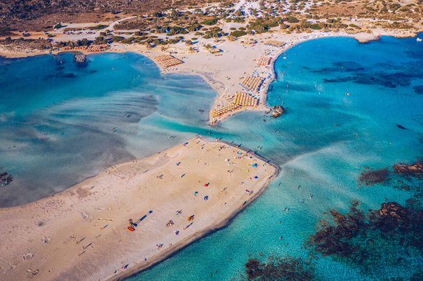 Aerial drone shot of beautiful turquoise beach with pink sand Elafonissi, Crete, Greece. Best beaches of Mediterranean, Elafonissi beach, Crete, Greece. Famous Elafonisi beach on Greece island, Crete. - Zdjęcie, obraz