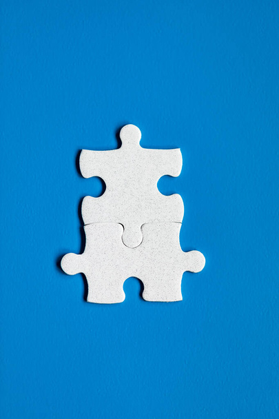 Closeup of jigsaw puzzle isolated. Missing jigsaw puzzle piece, business concept for completing the puzzle piece. Group of puzzle and a puzzle piece. Teamwork concept. Think difference concept.  - Foto, Imagen