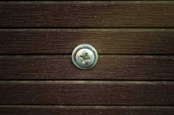 close up shot screw on wooden planks - Photo, Image