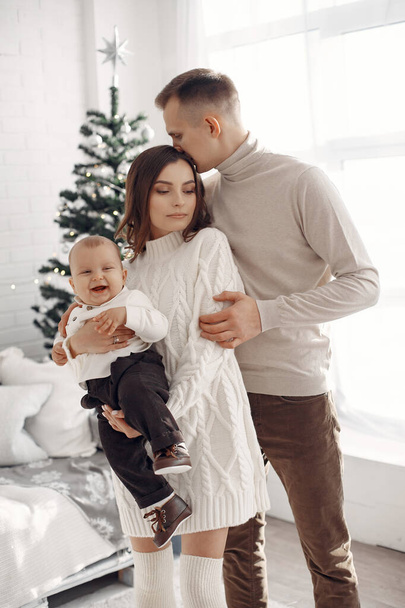 Family in Christmas clothes at home - Valokuva, kuva
