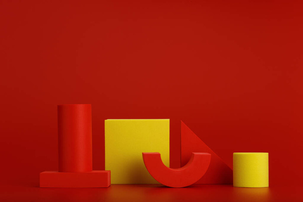 Abstract duotone composition with red and yellow geometric figures on red background with copy space - 写真・画像