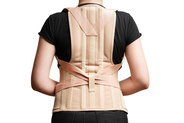 orthopedic corset on the female body isolated on a white background - Фото, зображення
