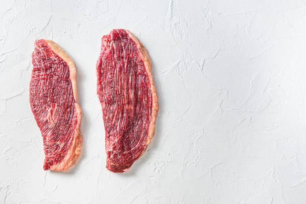 Organic picanha beef meat steaks, over white textured  background,  top view space for text - Foto, afbeelding
