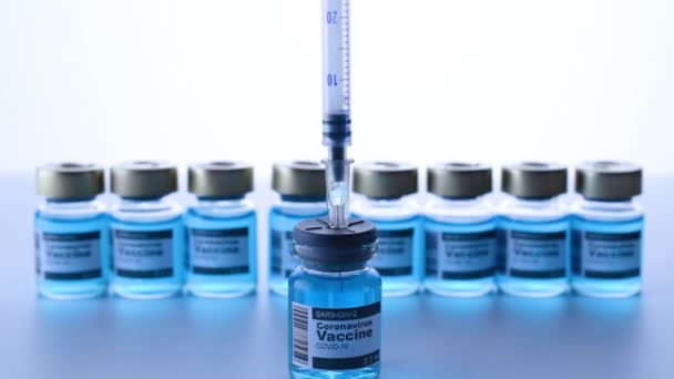 Vial syringe. Medical syringe with needle for protection flu virus and coronavirus. Covid vaccine on white. Medicine concept vaccination hypodermic injection treatment - Footage, Video