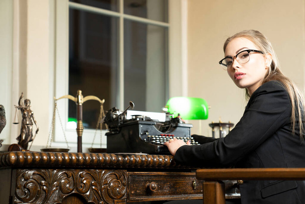 Young female lawyer during work in chamber.  - Photo, Image