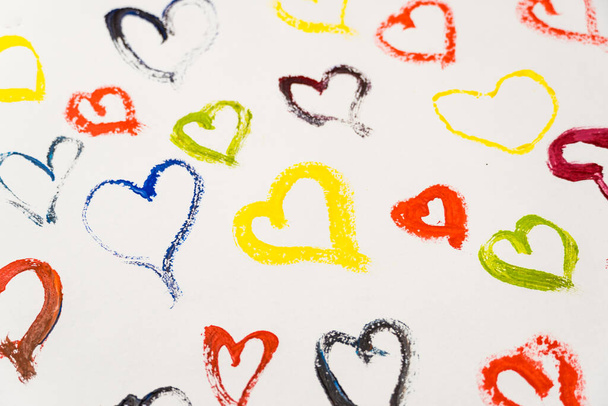 Colorful hearts are drawn with paints on a white background. Valentine's day card - Valokuva, kuva
