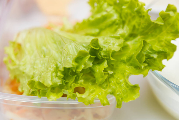 Fresh green lettuce leaf. Diet and nutrition. Selective focus with blurred background. - Fotografie, Obrázek